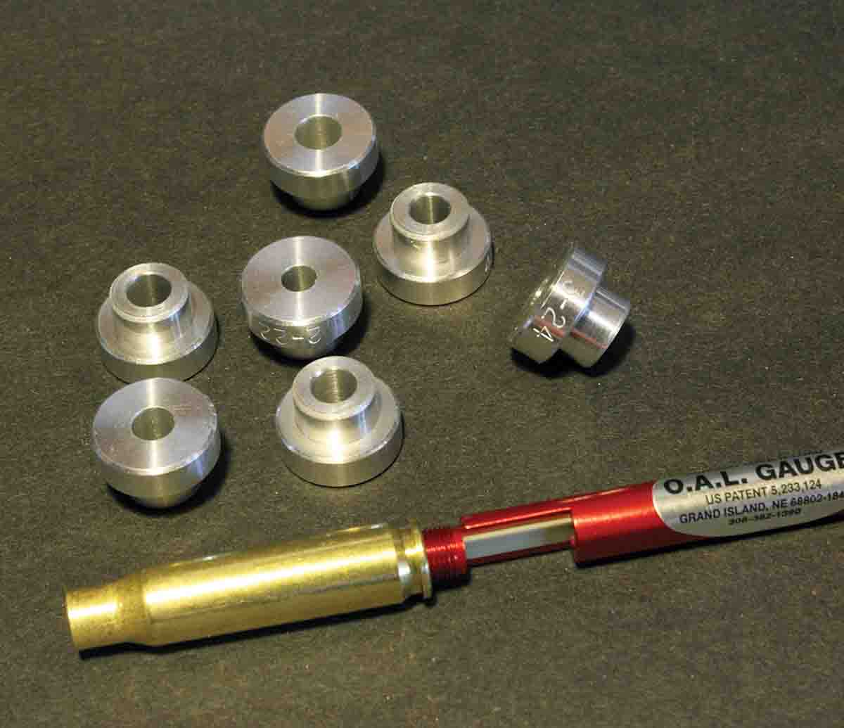 Determine seating depth with the Hornady tool with a threaded-base case (here a .308 Winchester) and a selection of ogive bushings. Neither are very expensive and can often be found at gun stores.